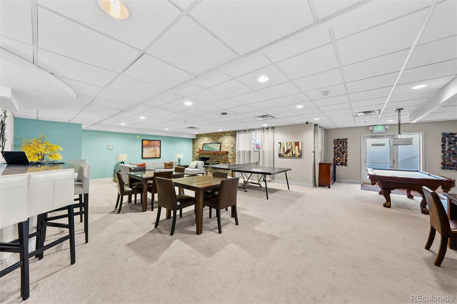2 Adams Street, Unit 806 Denver, CO 80206 - Photo 30 of 34 a view of a dining room with furniture and a rug