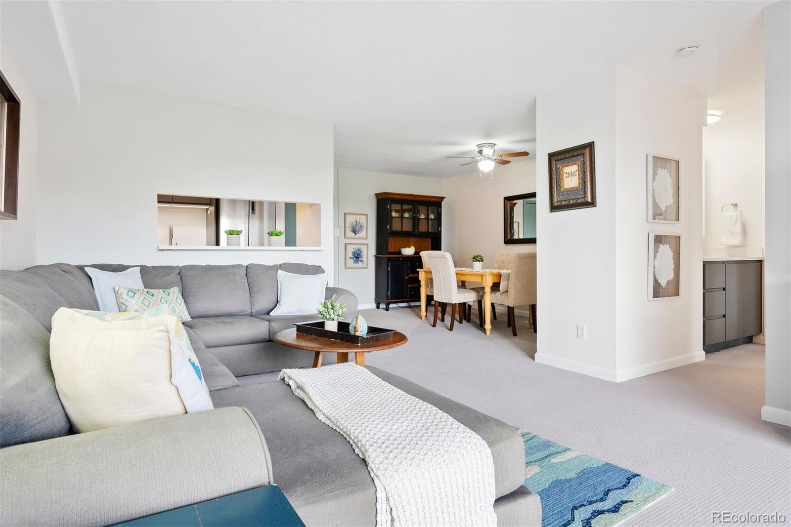 2 Adams Street, Unit 806 Denver, CO 80206 - Photo 5 of 34 a living room with furniture and a couch
