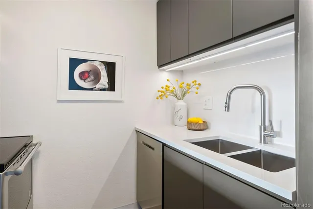 a living room with furniture and painting on the wall