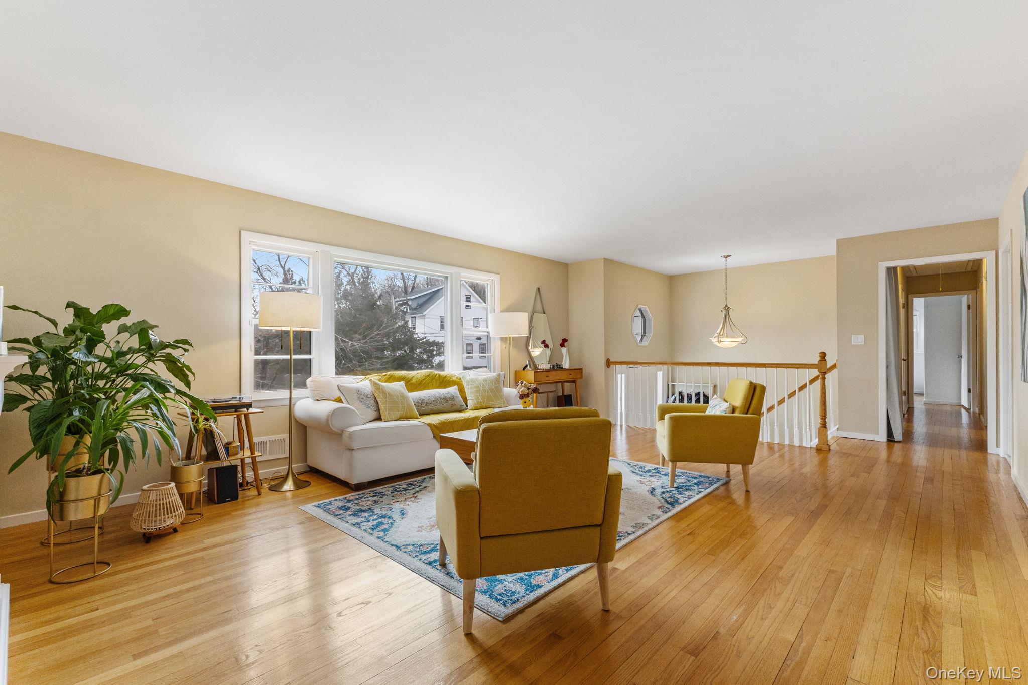 15 Meadow Place Rye, NY 10580 - Photo 19 of 39 Looking from main floor bedroom into the living room, with entrance stairway and doorway to more family bedrooms in the distance.
