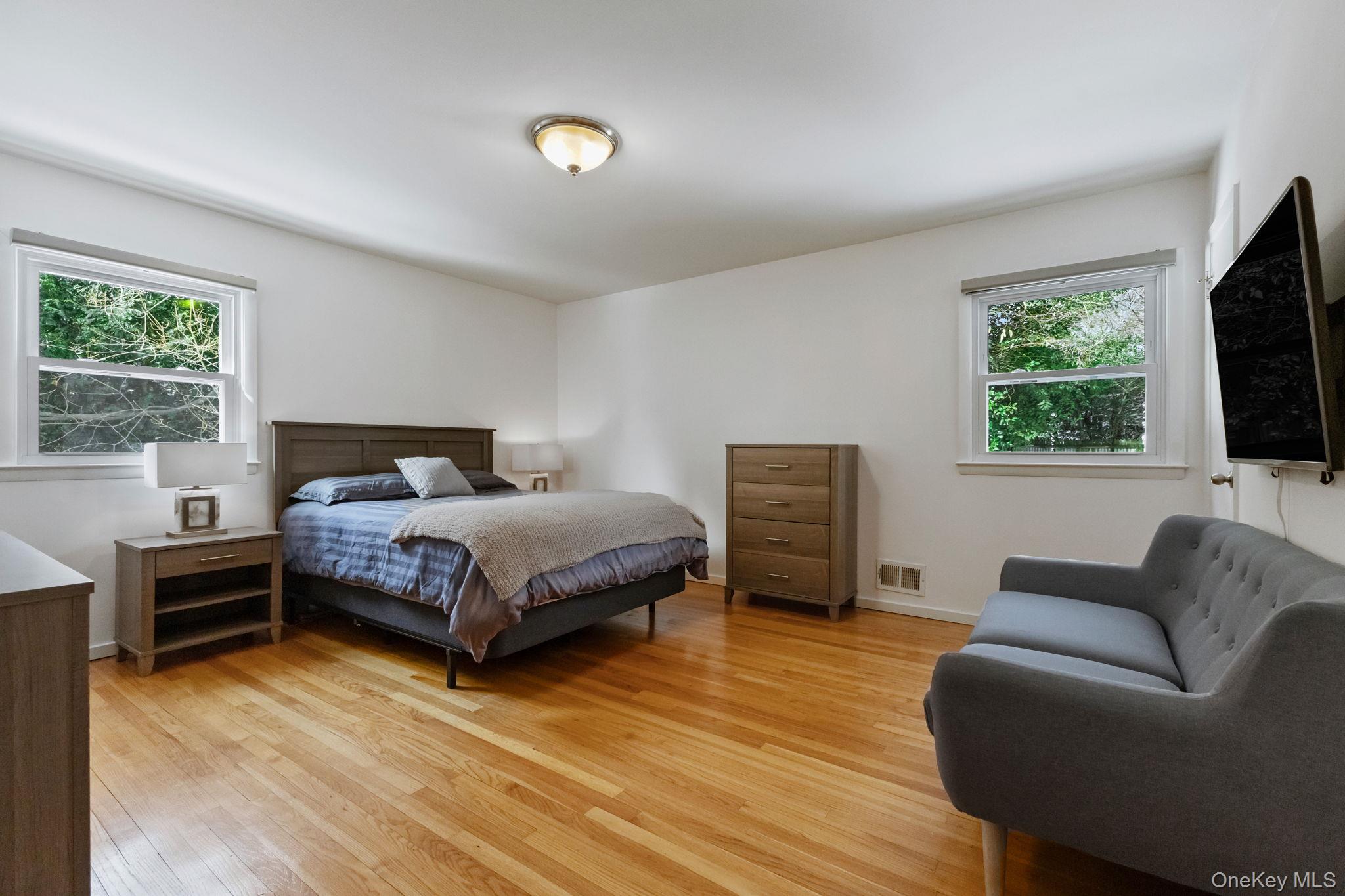 15 Meadow Place Rye, NY 10580 - Photo 23 of 39 Primary bedroom offers views of both the side and back yard of the home.