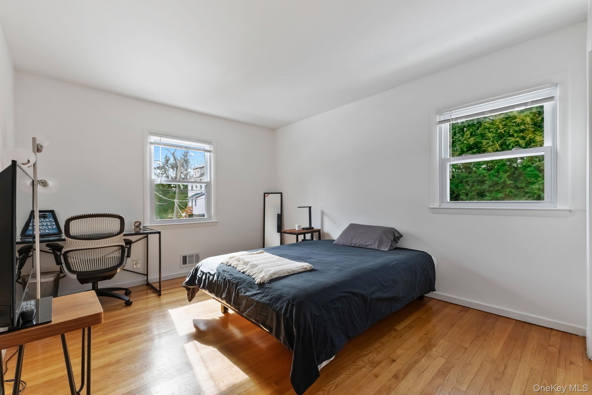 15 Meadow Place Rye, NY 10580 - Photo 25 of 39 Another bedroom with hardwood floor and double closet. Two windows overlook front and side yard.