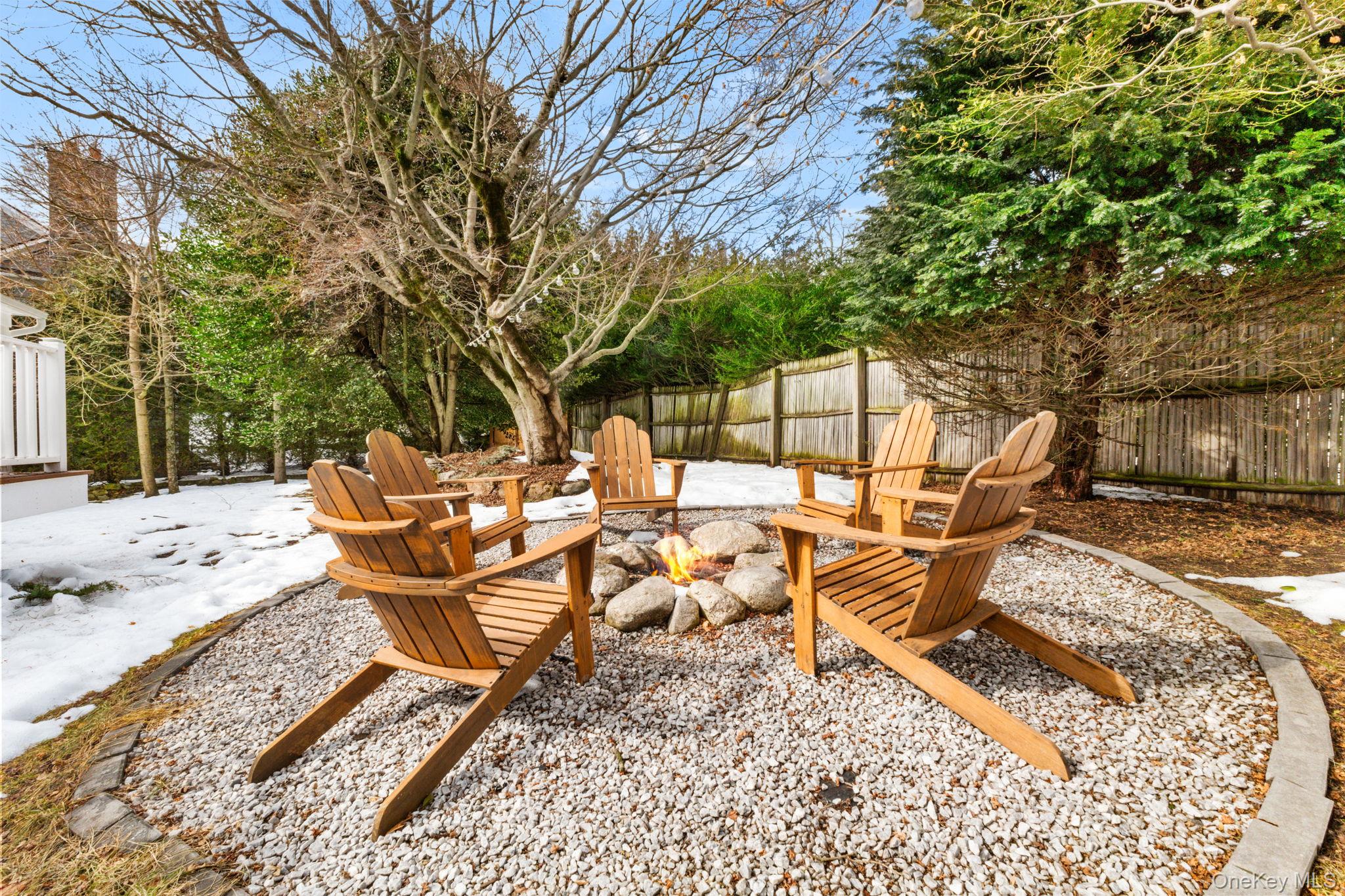 15 Meadow Place Rye, NY 10580 - Photo 31 of 39 This cozy firepit area was created by the current owners, who are offering their Adirondack chairs with the home.