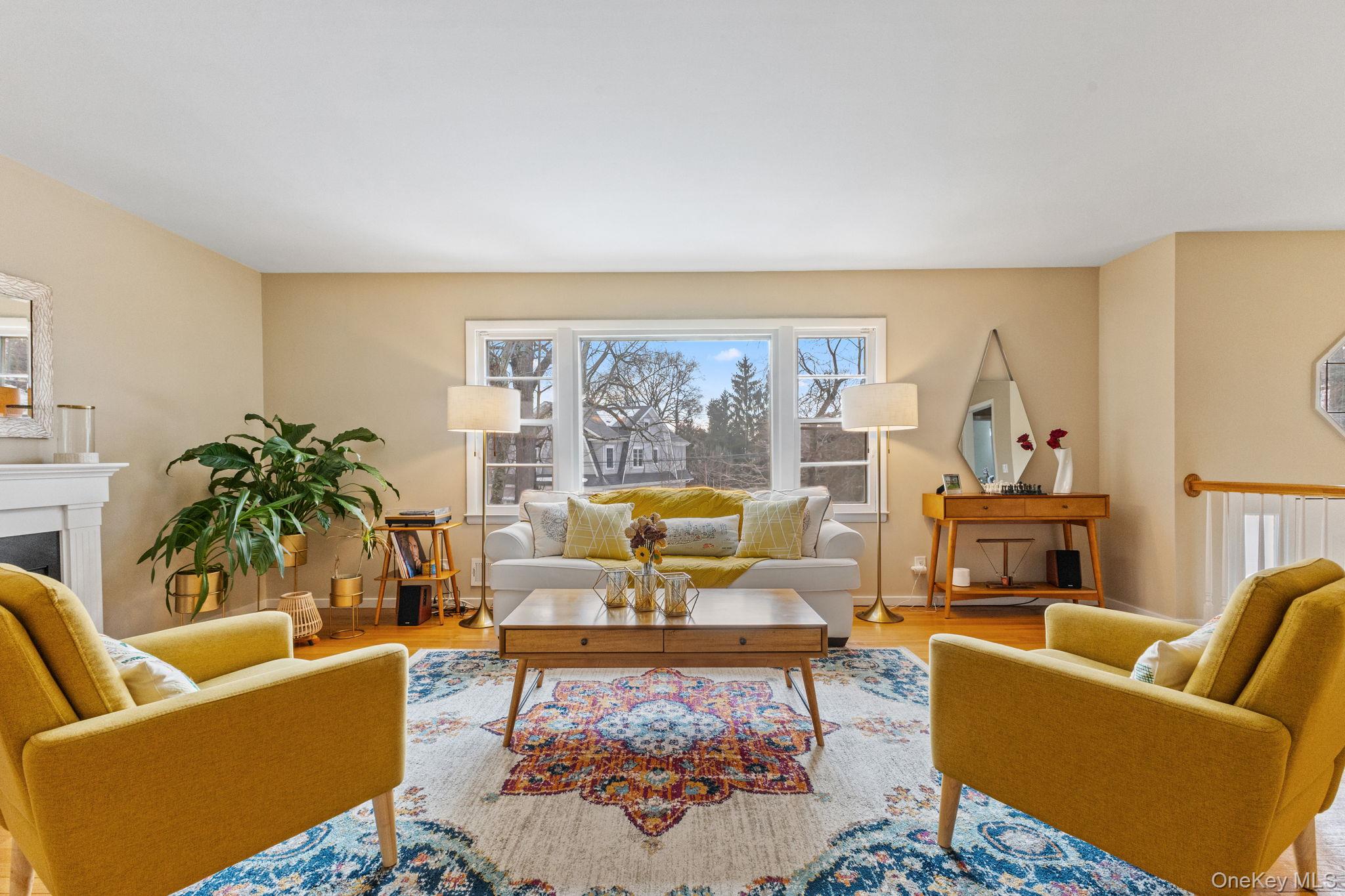 15 Meadow Place Rye, NY 10580 - Photo 4 of 39 Another view of the living room with entryway staircase shown at the right. Oversized window overlooks the front yard.