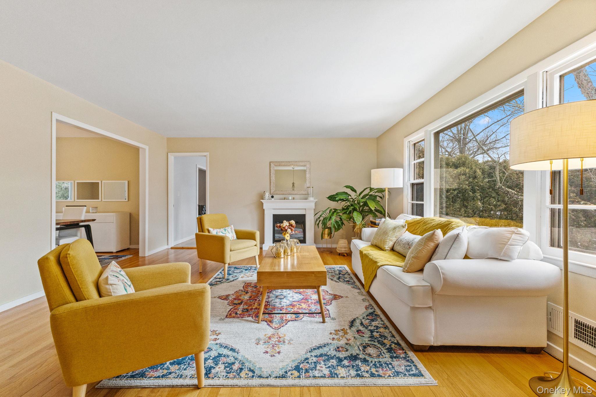 15 Meadow Place Rye, NY 10580 - Photo 6 of 39 Free-standing electric fireplace adds warmth and ambiance. Large opening on left leads to formal dining room.