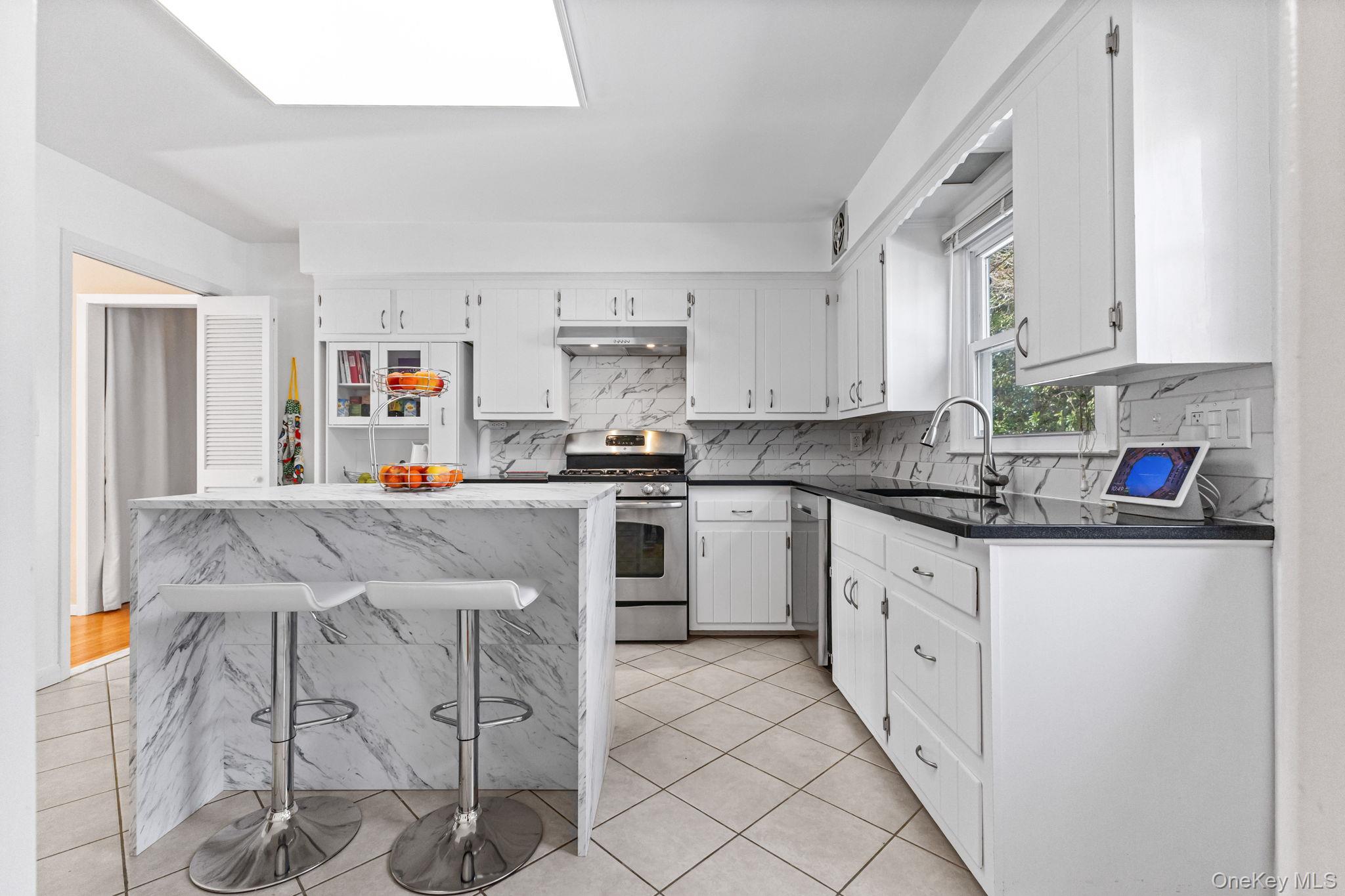 15 Meadow Place Rye, NY 10580 - Photo 8 of 39 Free-standing kitchen island with cabinets and seating can be easily moved to suit your needs.
