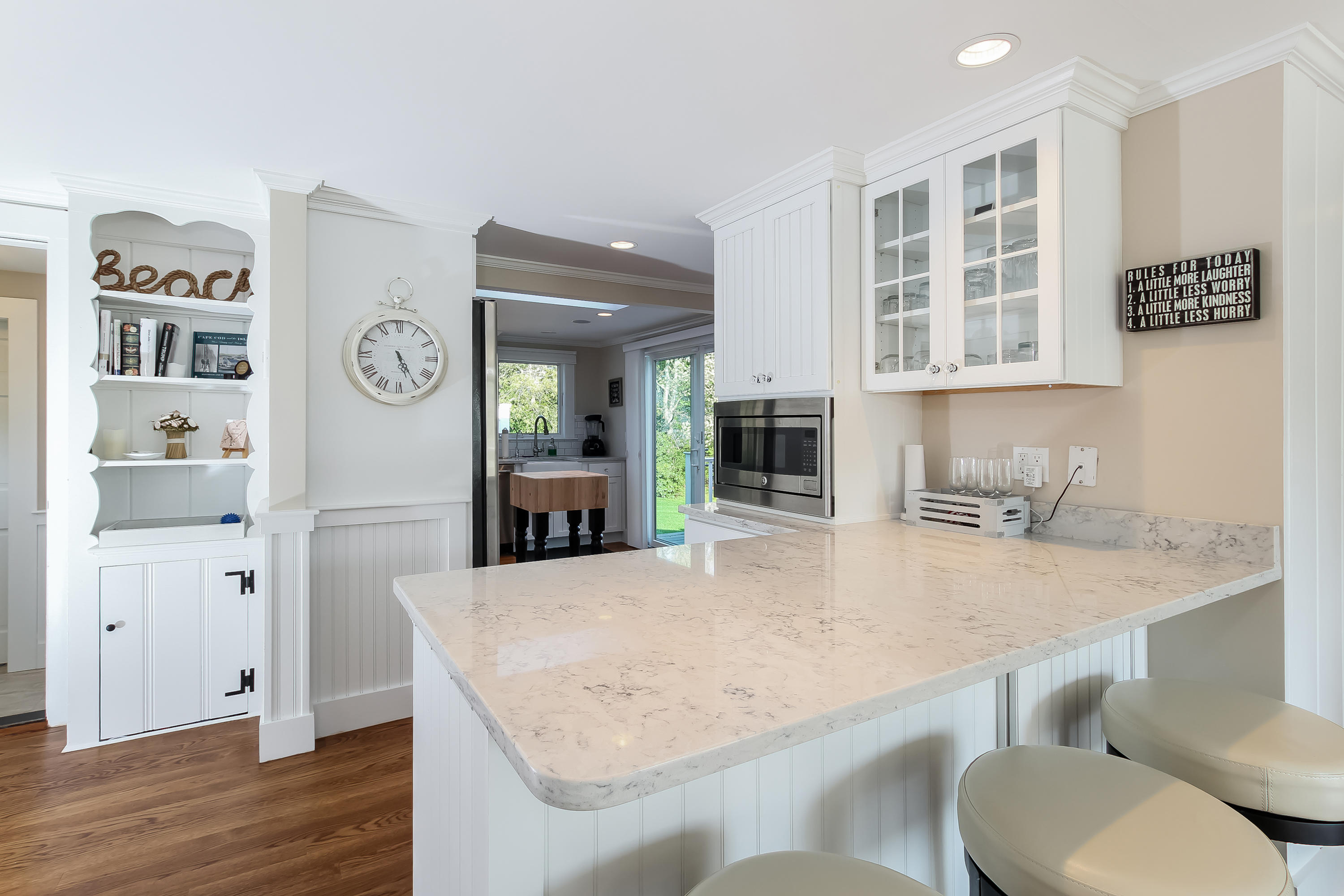 15 Colonial Way Harwich Port, MA 02646 - Photo 11 of 28 a kitchen with stainless steel appliances granite countertop a sink and a refrigerator