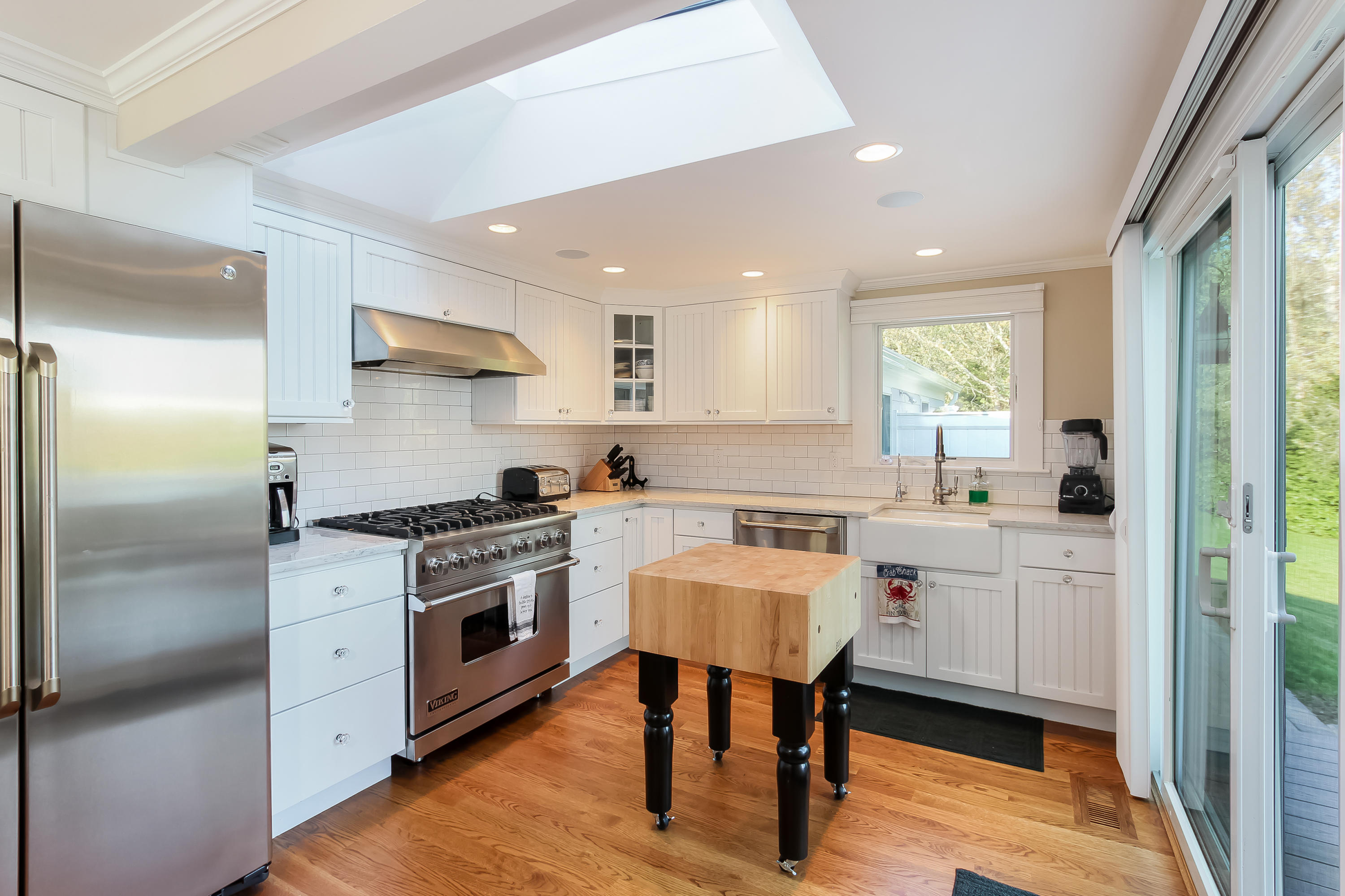 15 Colonial Way Harwich Port, MA 02646 - Photo 13 of 28 a kitchen with a stove a sink and a refrigerator
