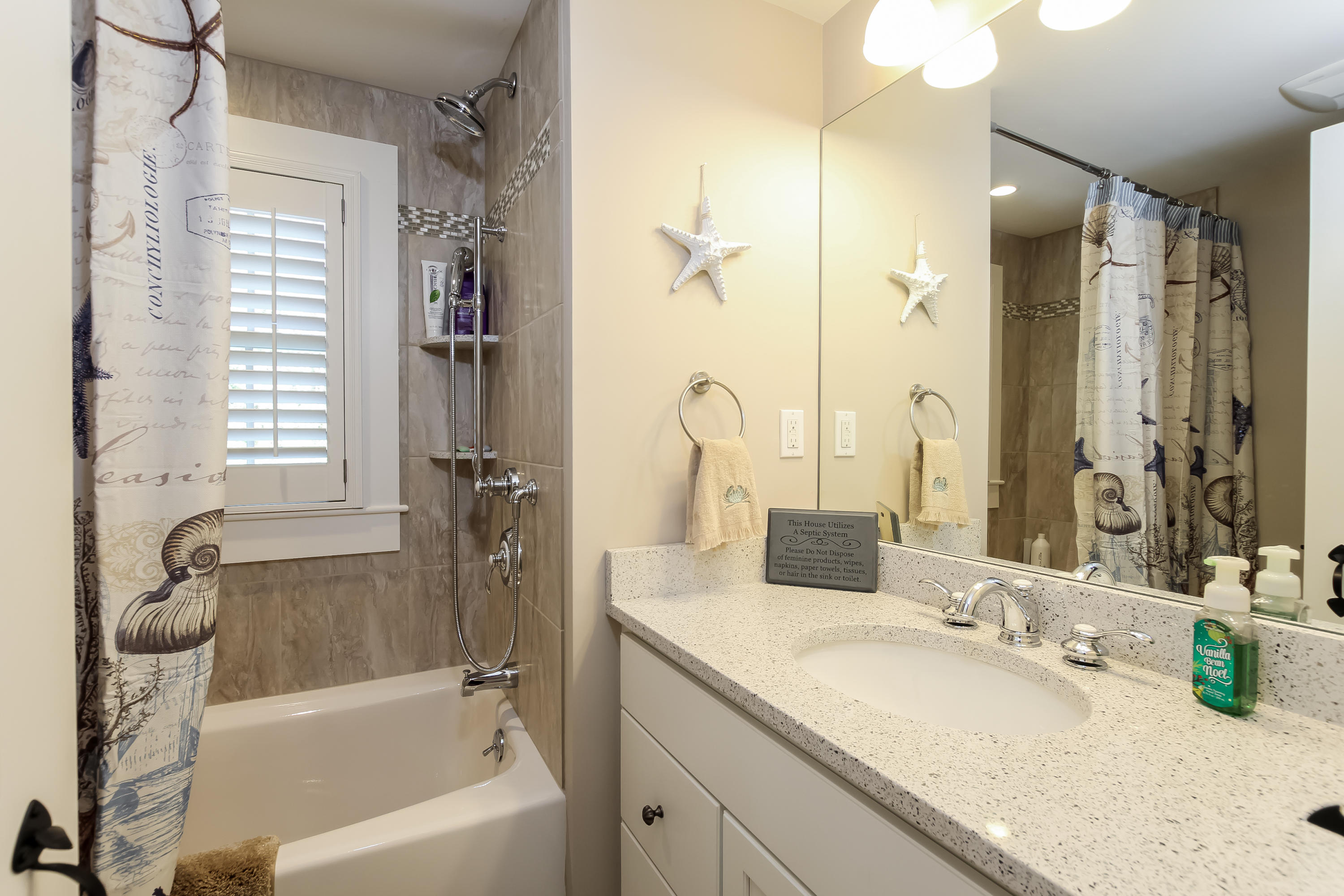 15 Colonial Way Harwich Port, MA 02646 - Photo 19 of 28 a bathroom with a granite countertop tub sink and mirror