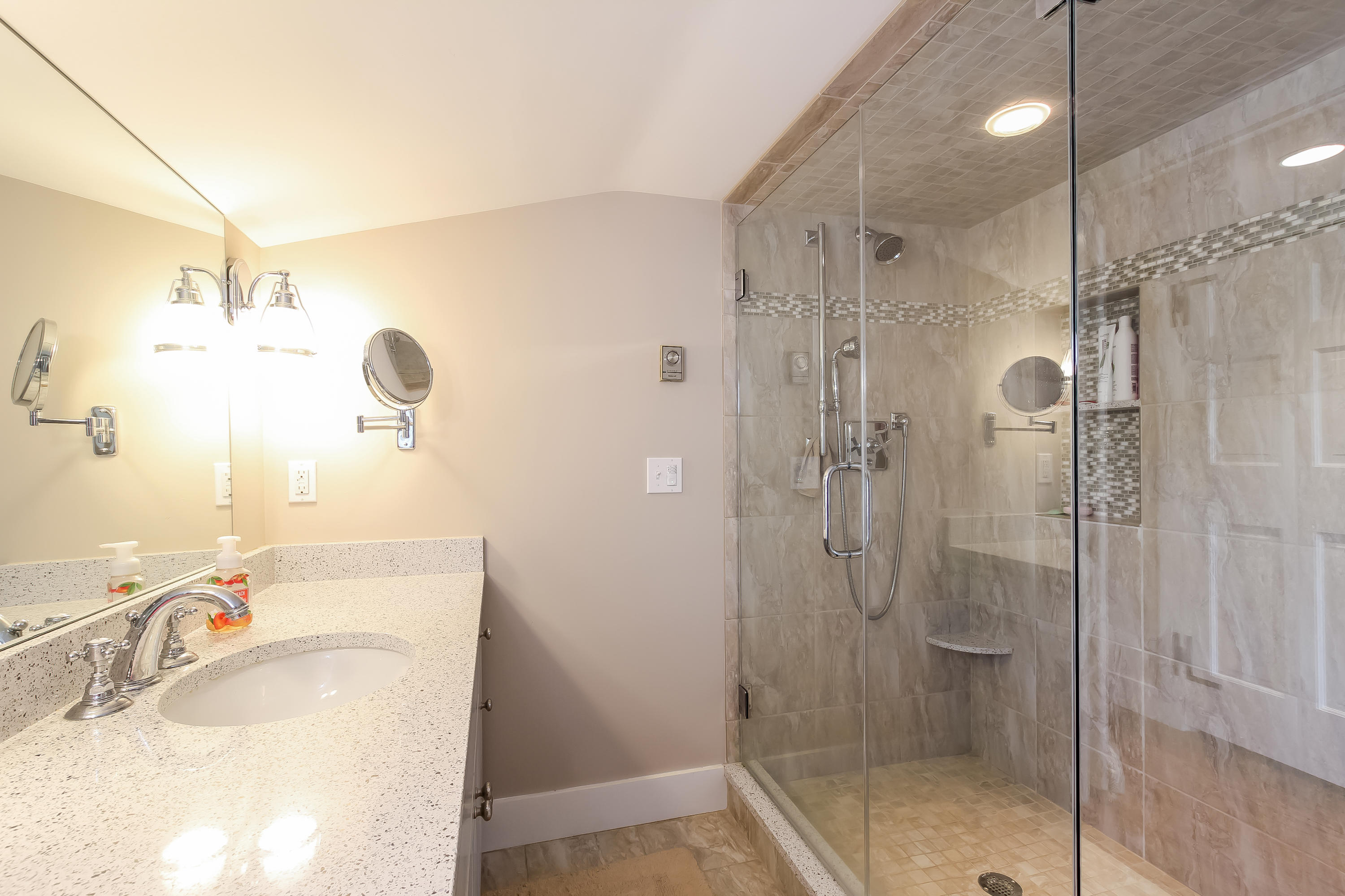 15 Colonial Way Harwich Port, MA 02646 - Photo 22 of 28 a bathroom with a shower sink and mirror