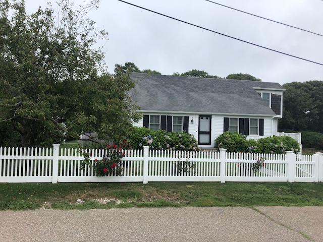 15 Colonial Way Harwich Port, MA 02646 - Photo 3 of 28 a front view of a house with a garden