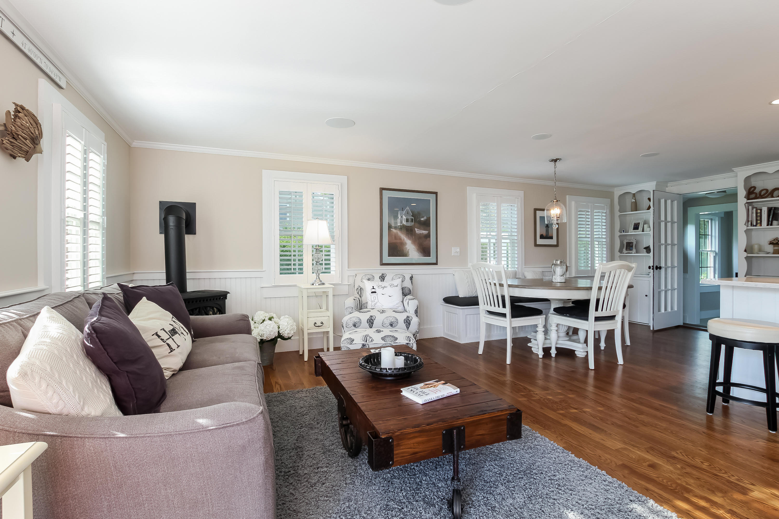 15 Colonial Way Harwich Port, MA 02646 - Photo 7 of 28 a living room with furniture a table and a large window