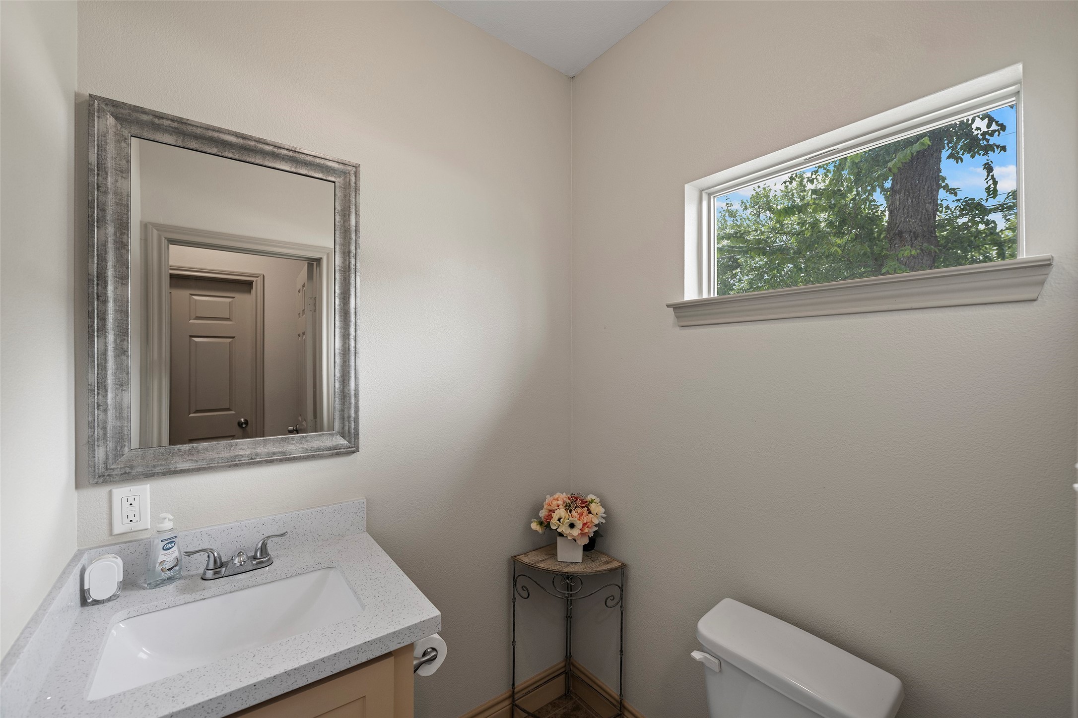 1541 3rd Street Hempstead, TX 77445 - Photo 11 of 26 a bathroom with a sink a mirror and a window
