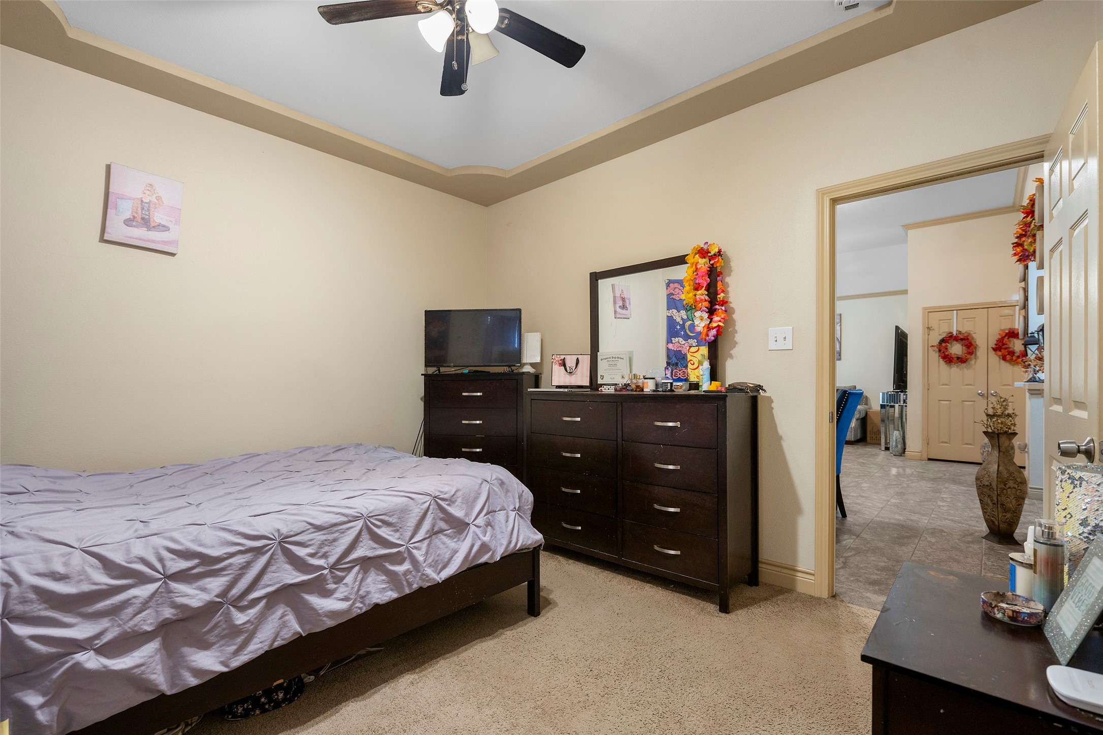 1541 3rd Street Hempstead, TX 77445 - Photo 16 of 26 a bedroom with a bed and a dresser