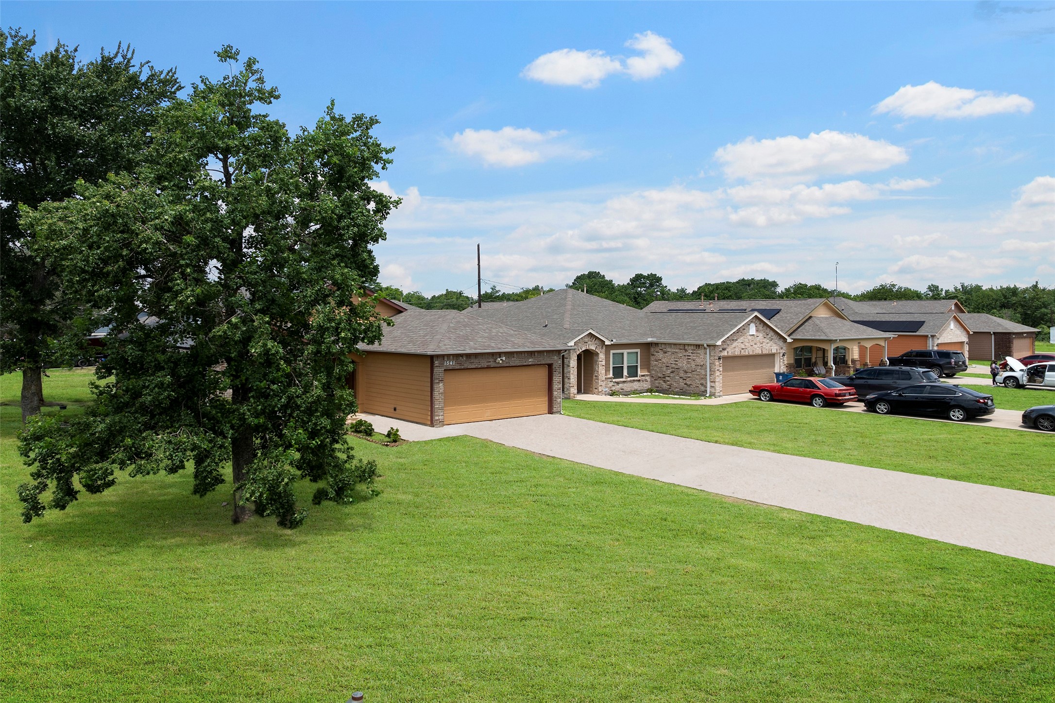 1541 3rd Street Hempstead, TX 77445 - Photo 20 of 26 a aerial view of a house with a big yard