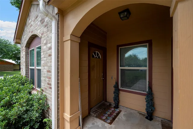 a view of a door and chair front door