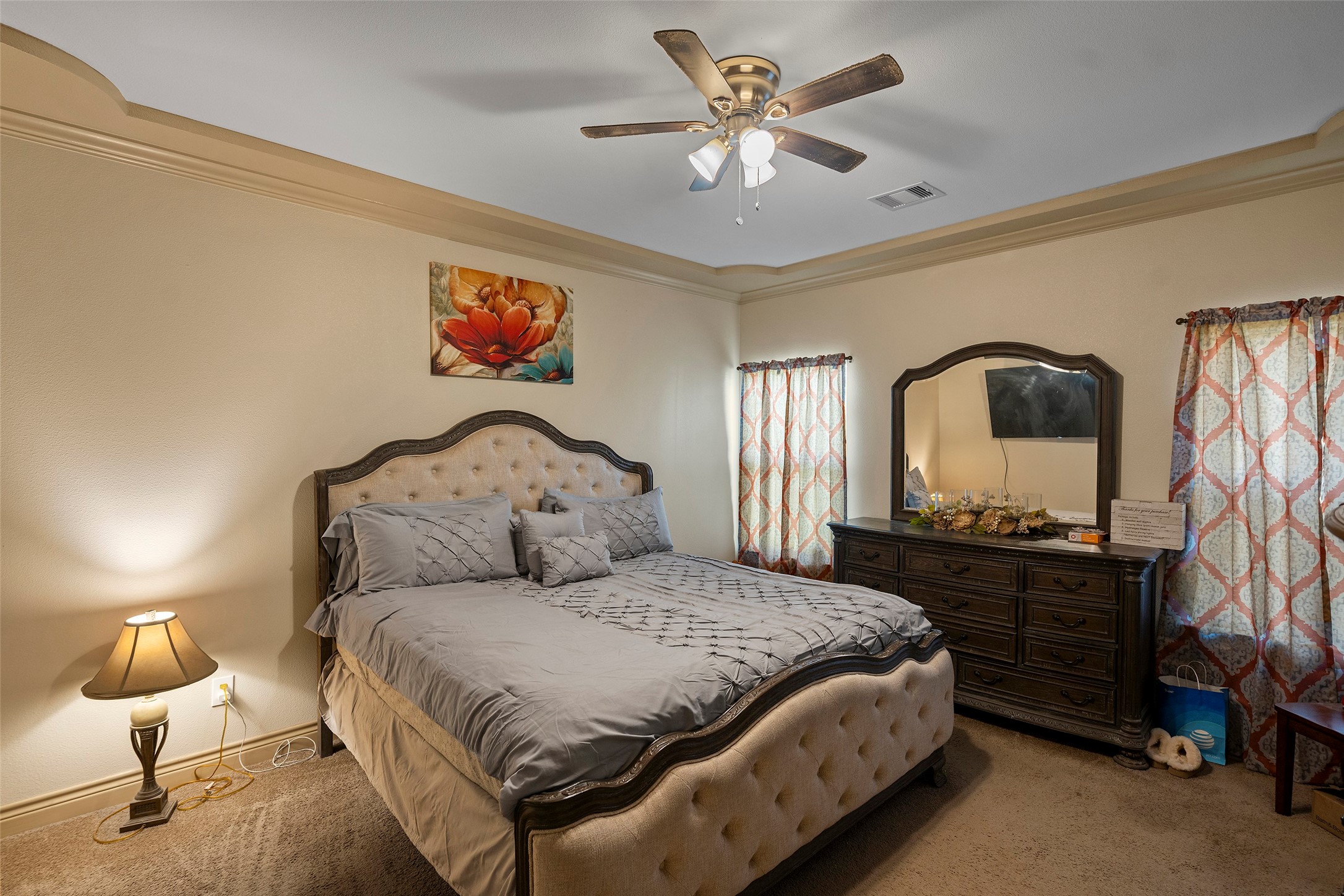 1541 3rd Street Hempstead, TX 77445 - Photo 7 of 26 a spacious bedroom with a large bed and a chandelier