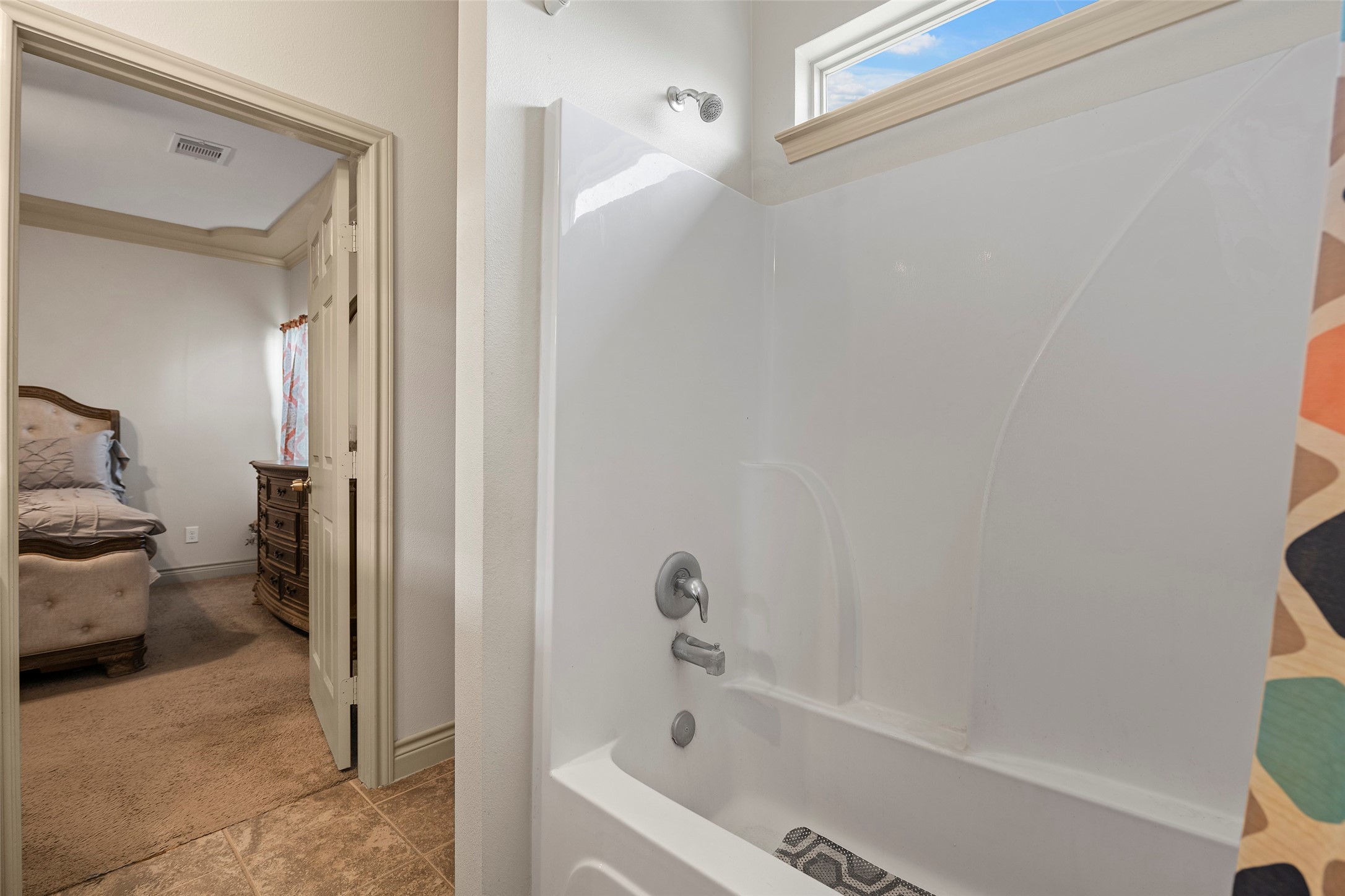 1541 3rd Street Hempstead, TX 77445 - Photo 9 of 26 a bathroom with a tub and a shower