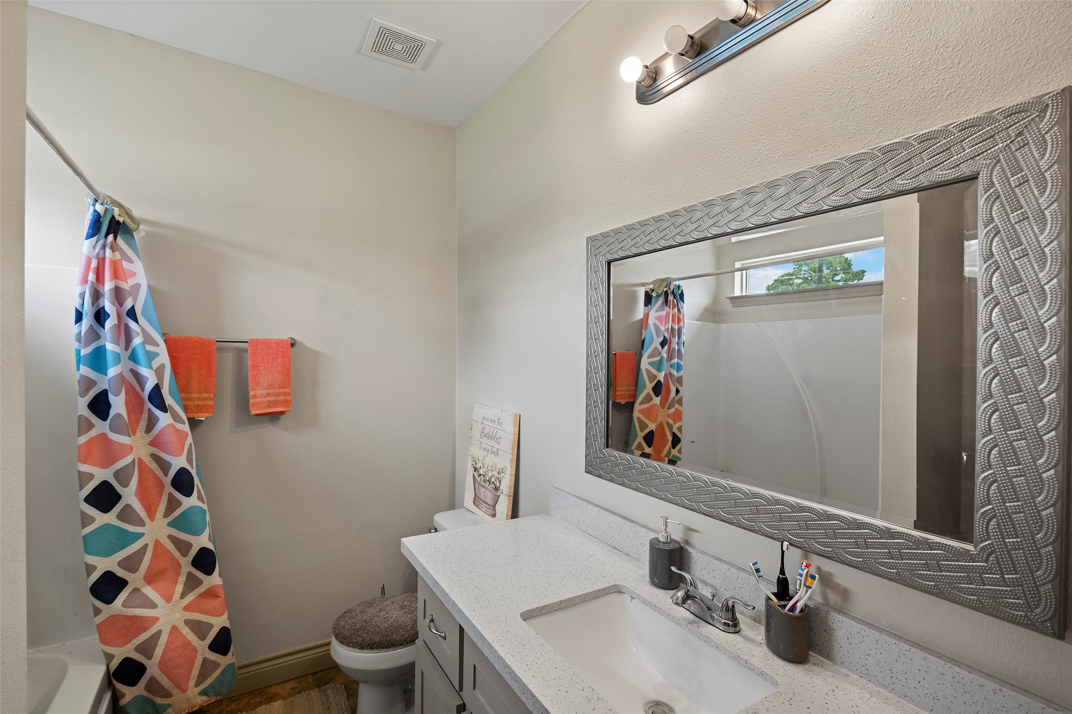 1541 3rd Street Hempstead, TX 77445 - Photo 10 of 26 a bathroom with a sink and a mirror