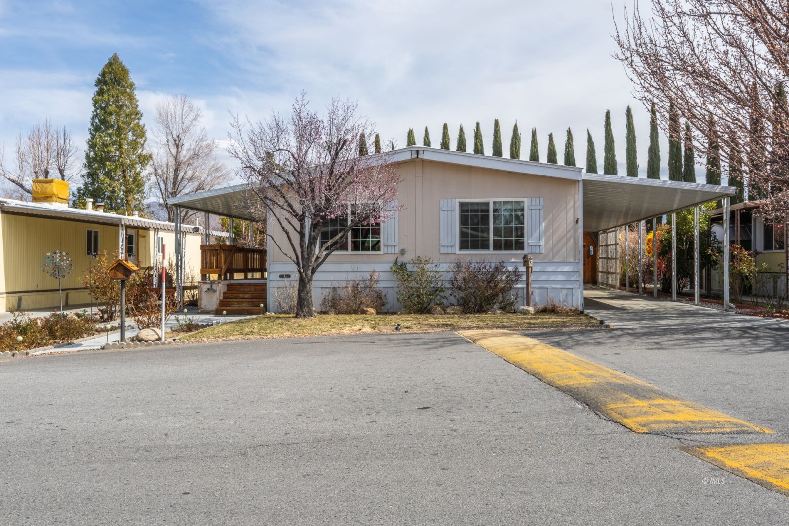 1358 MacGregor Avenue Bishop, CA 93514 - Photo 1 of 30 a front view of a house with a yard and garage