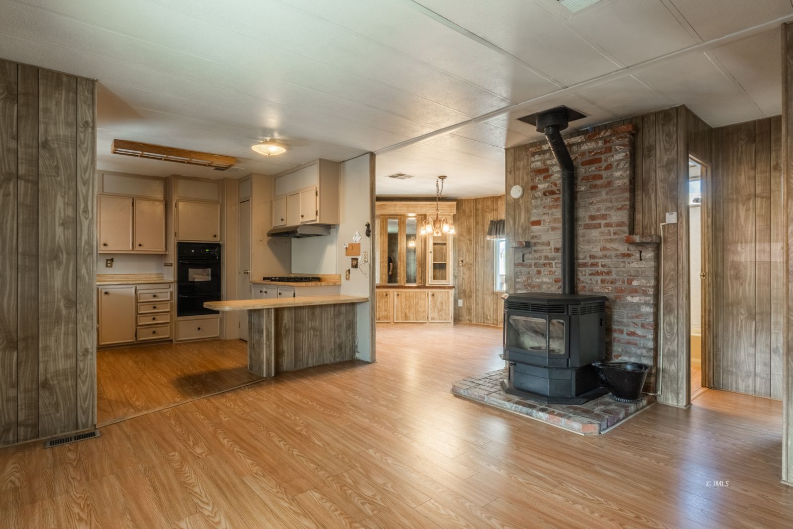 1358 MacGregor Avenue Bishop, CA 93514 - Photo 9 of 30 a large kitchen with a large window and stainless steel appliances