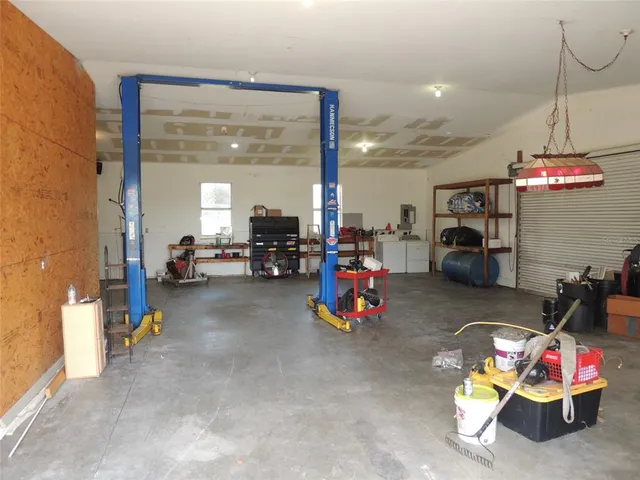 a view of storage and utility room with a window