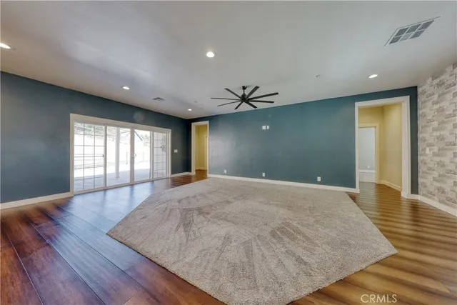a view of kitchen with cabinets and wooden floor
