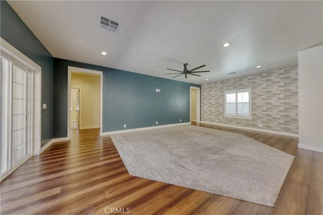 a large kitchen with kitchen island a sink stainless steel appliances and cabinets