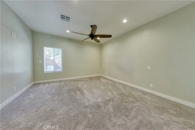 a view of a porch with furniture and next to a yard