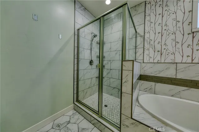 swimming pool view with a tub