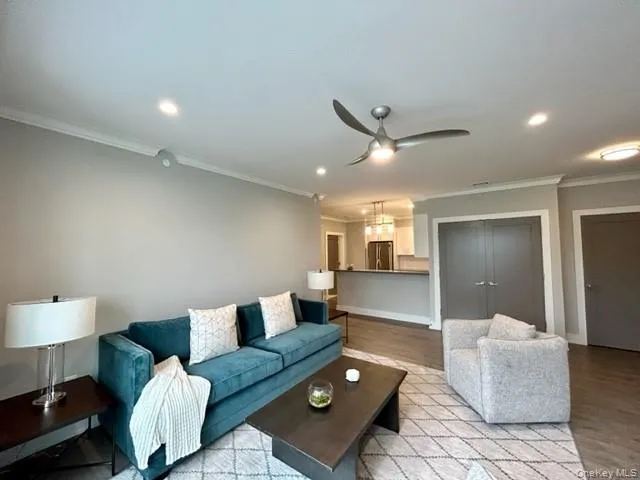 a living room with furniture and a table