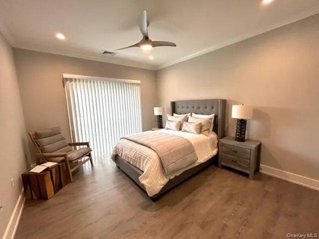 a spacious bedroom with a bed and a couch