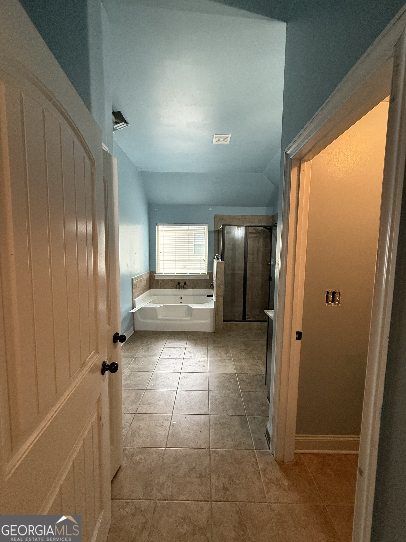 9159 Dover Street Lithia Springs, GA 30122 - Photo 14 of 17 a view of wooden floor and windows in a room
