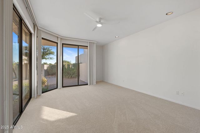 a view of an empty room with glass door