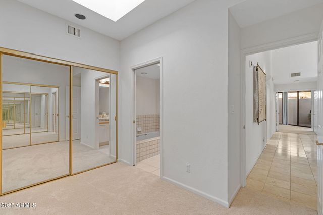 a spacious bathroom with a bathtub and a sink
