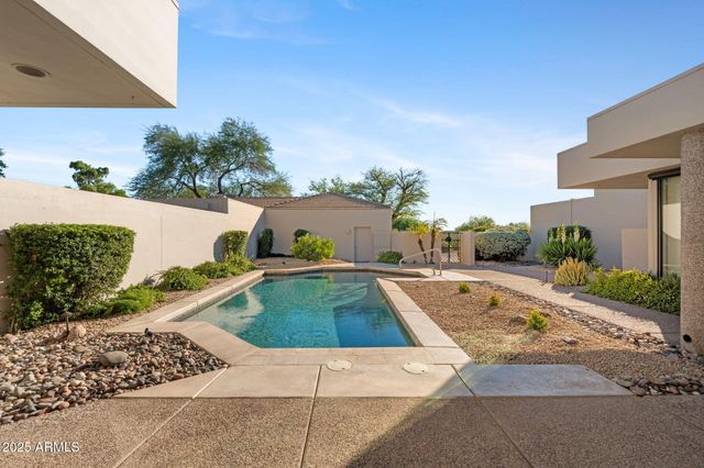 a view of swimming pool from a balcony