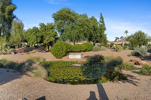 a view of a lake view with houses in back
