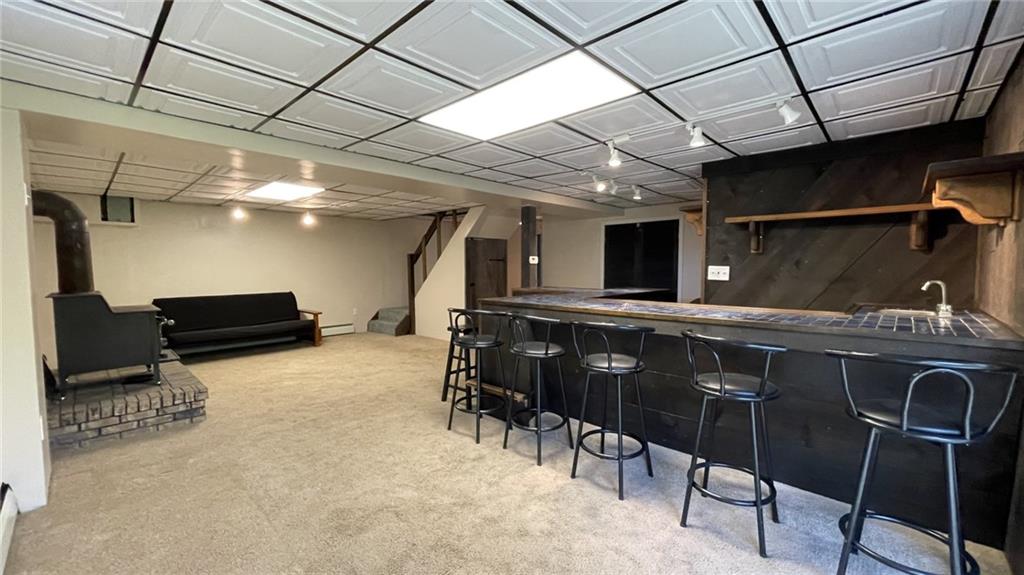 303 Elkhorn Road Monaca, PA 15061 - Photo 15 of 19 a room with furniture and a flat screen tv