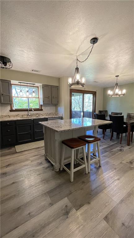 303 Elkhorn Road Monaca, PA 15061 - Photo 6 of 19 a large kitchen with kitchen island a sink table and chairs