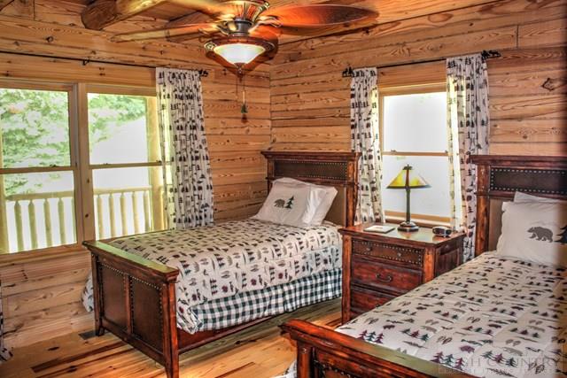 170 River Hills Road Lansing, NC 28643 - Photo 20 of 44 a bedroom with a bed next to a window