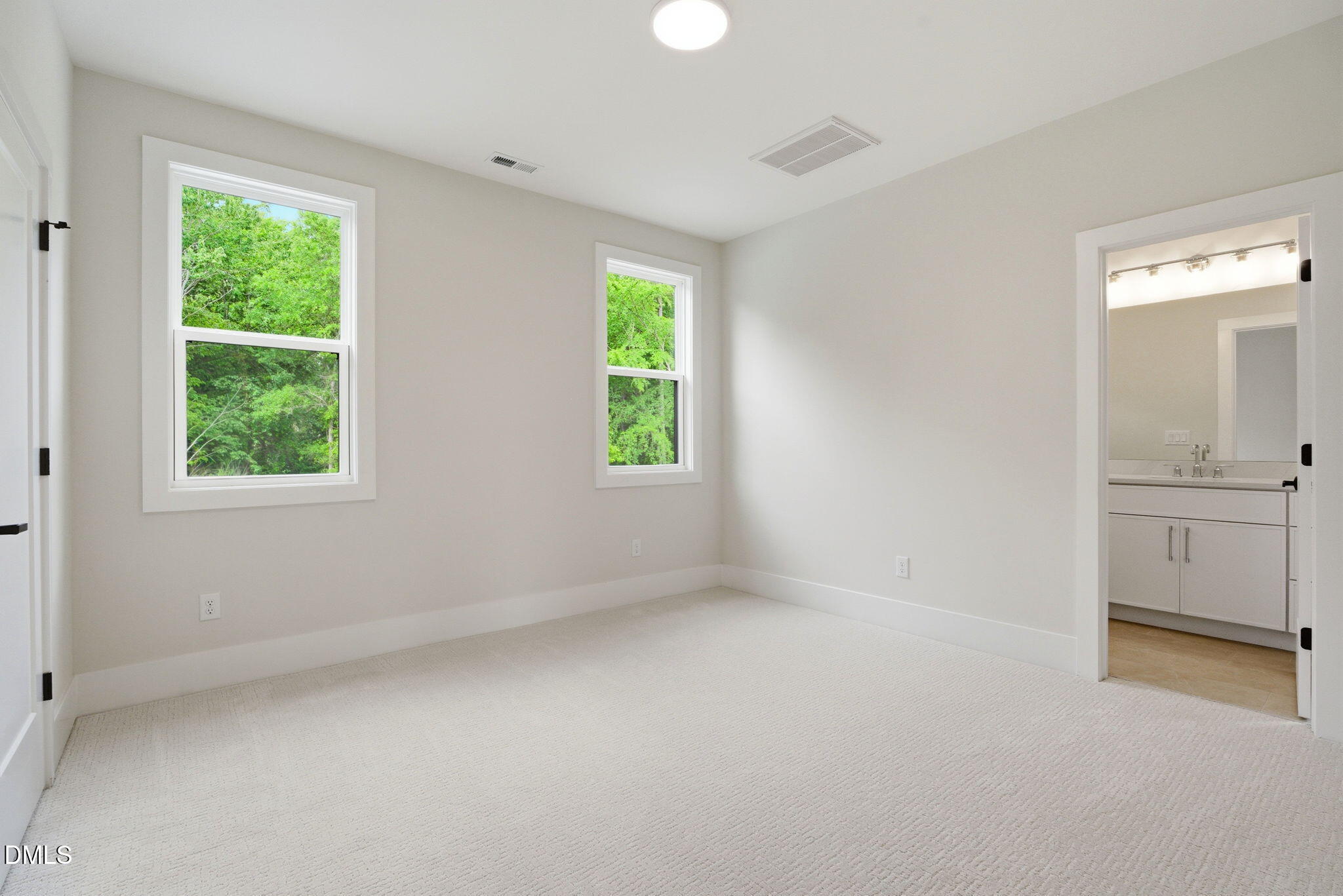 1304 Sanctuary Pond Drive Raleigh, NC 27606 - Photo 39 of 52 an empty room with windows and closet