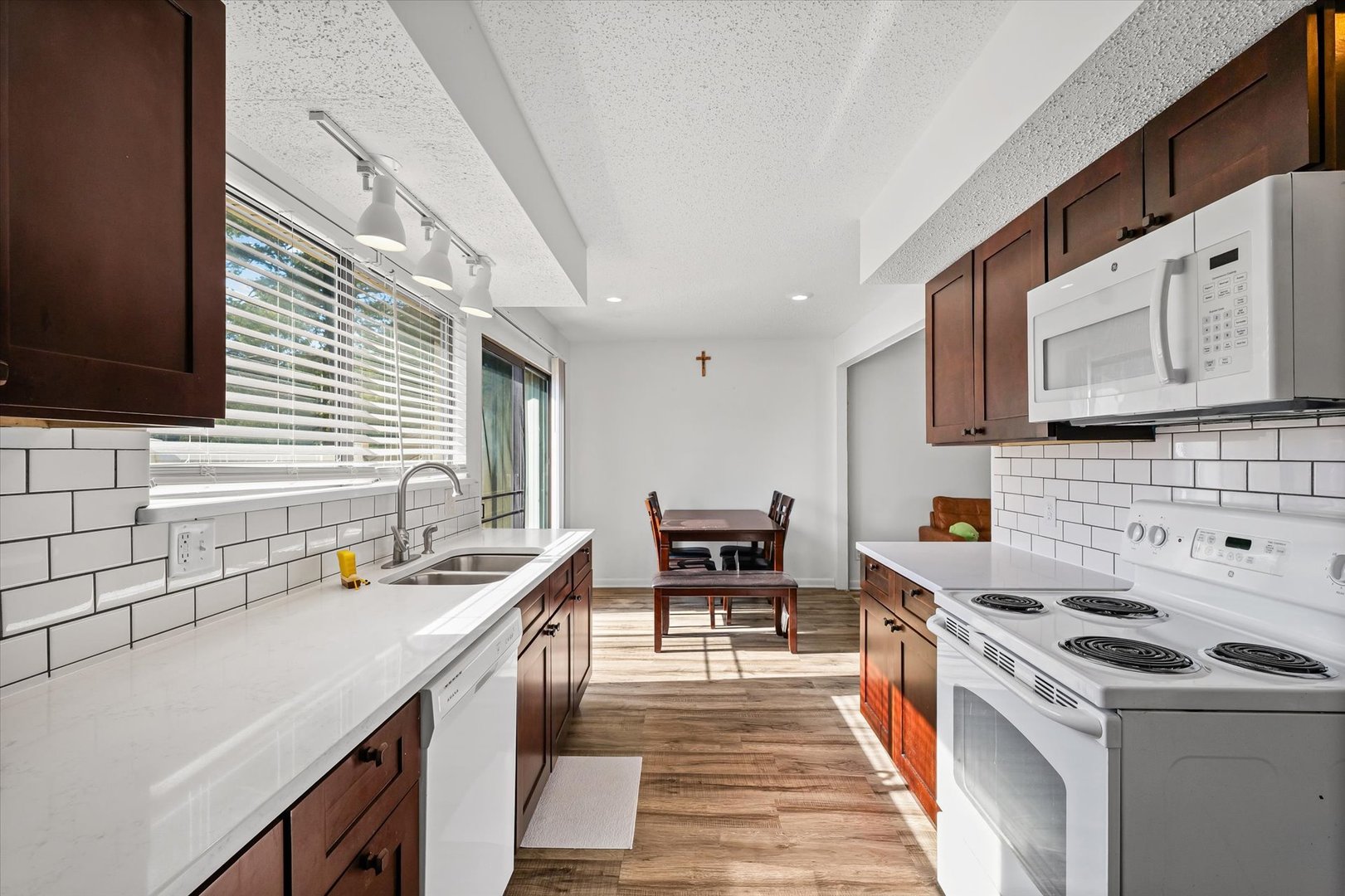 20 Colony W Drive Champaign, IL 61820 - Photo 12 of 26 a kitchen that has a lot of cabinets in it and wooden floor