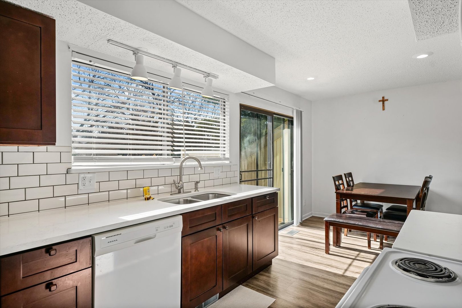 20 Colony W Drive Champaign, IL 61820 - Photo 13 of 26 a kitchen with a sink and wooden cabinets