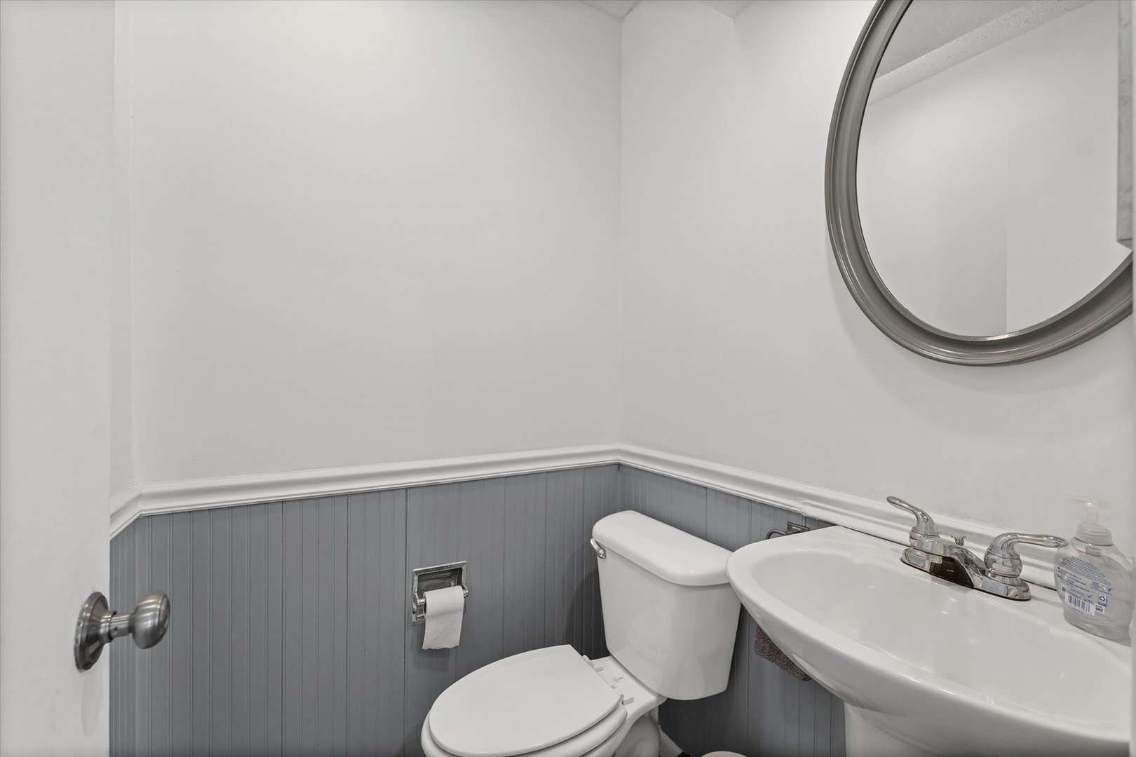 20 Colony W Drive Champaign, IL 61820 - Photo 15 of 26 a white toilet sitting next to a bathroom sink