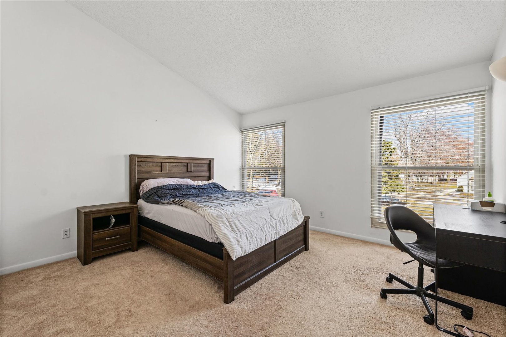 20 Colony W Drive Champaign, IL 61820 - Photo 16 of 26 a bedroom with a bed chair and a desk