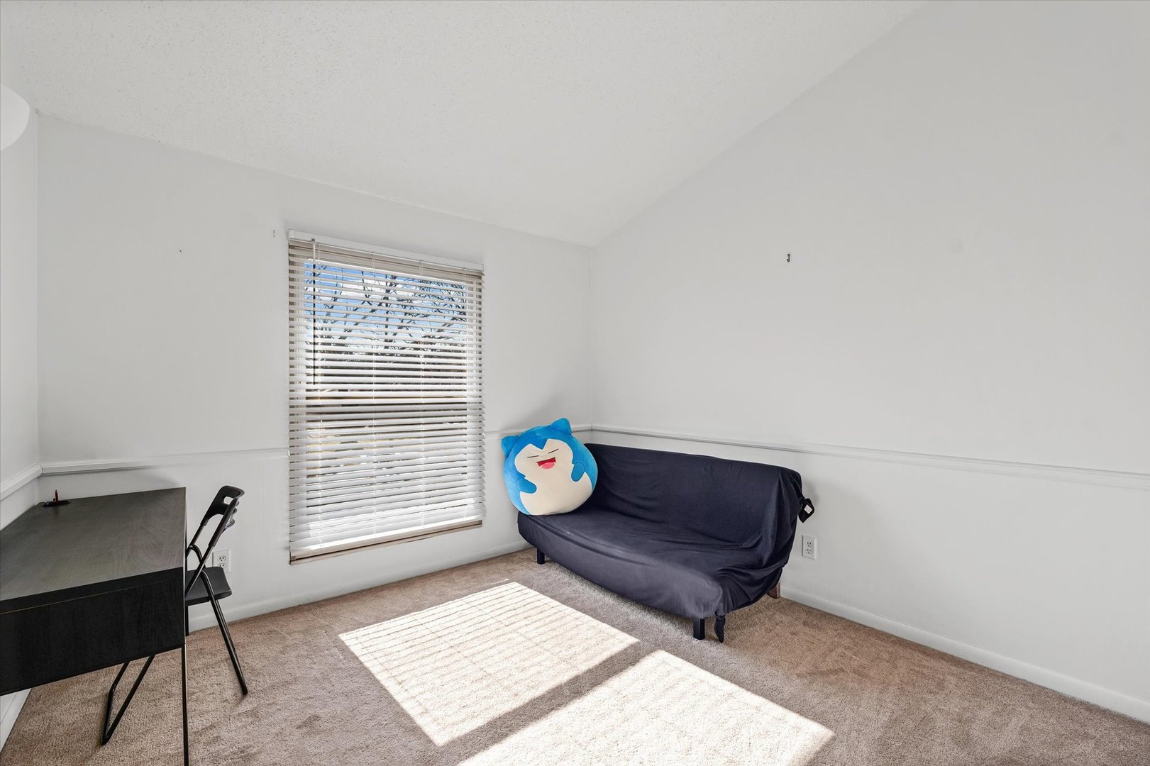 20 Colony W Drive Champaign, IL 61820 - Photo 19 of 26 a living room with a couch and a window