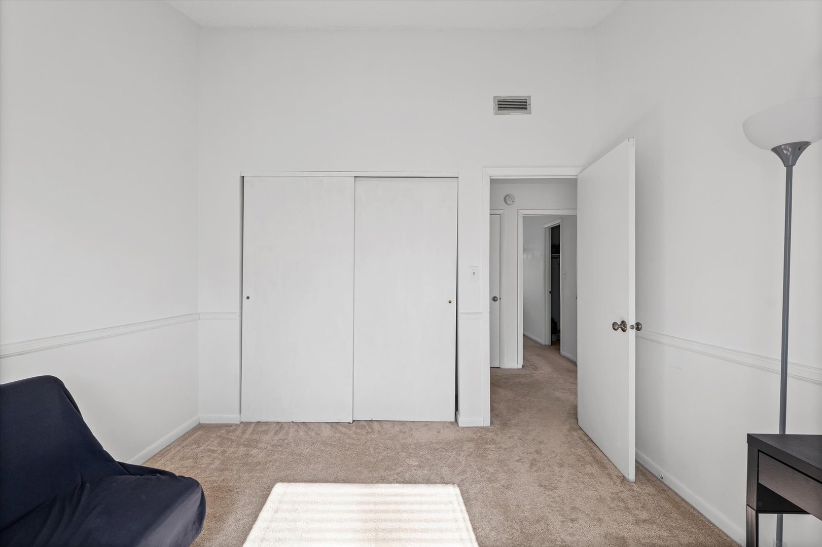 20 Colony W Drive Champaign, IL 61820 - Photo 20 of 26 a living room with a couch and a walk in closet