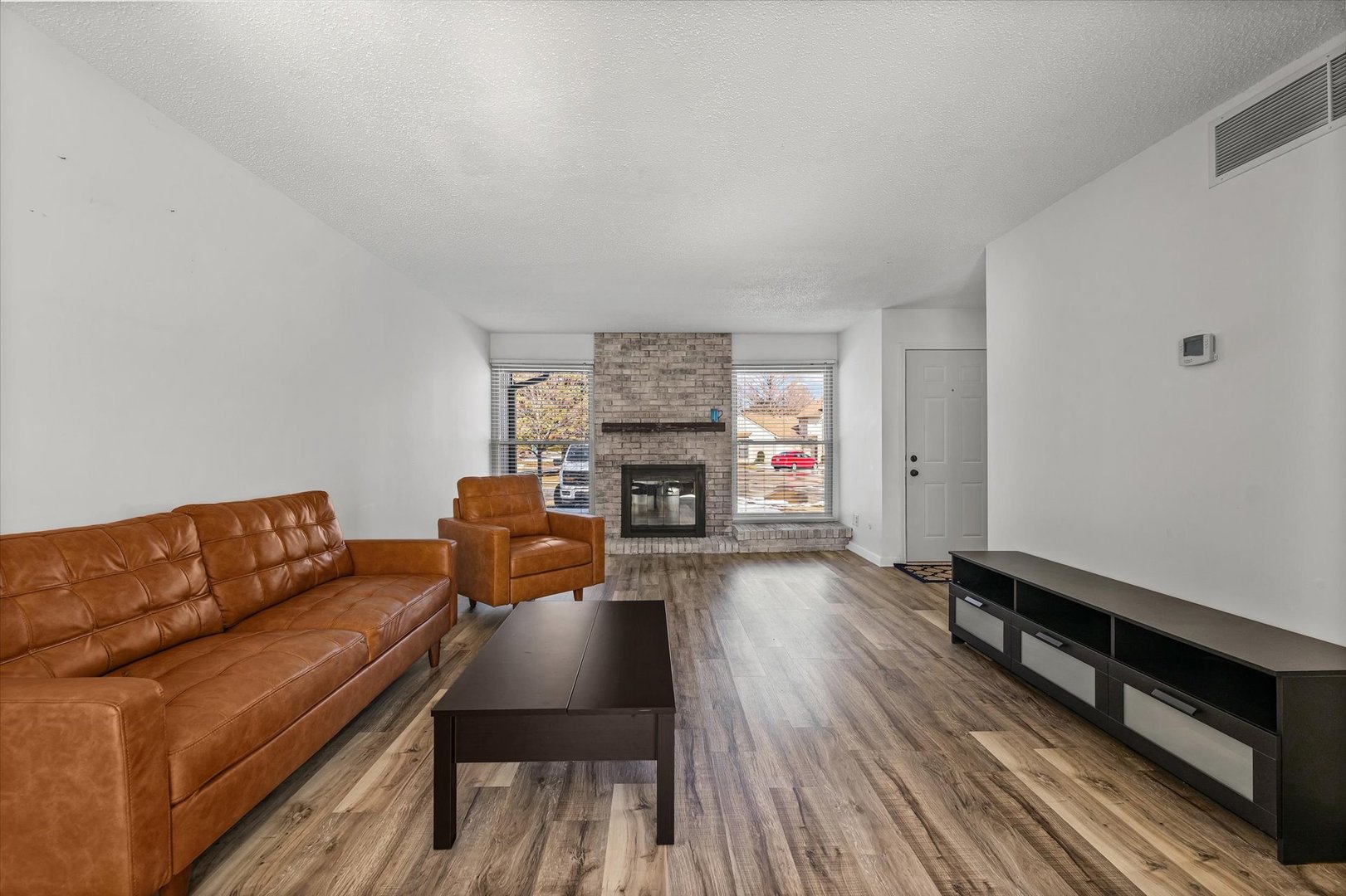 20 Colony W Drive Champaign, IL 61820 - Photo 4 of 26 a living room with furniture and a fireplace