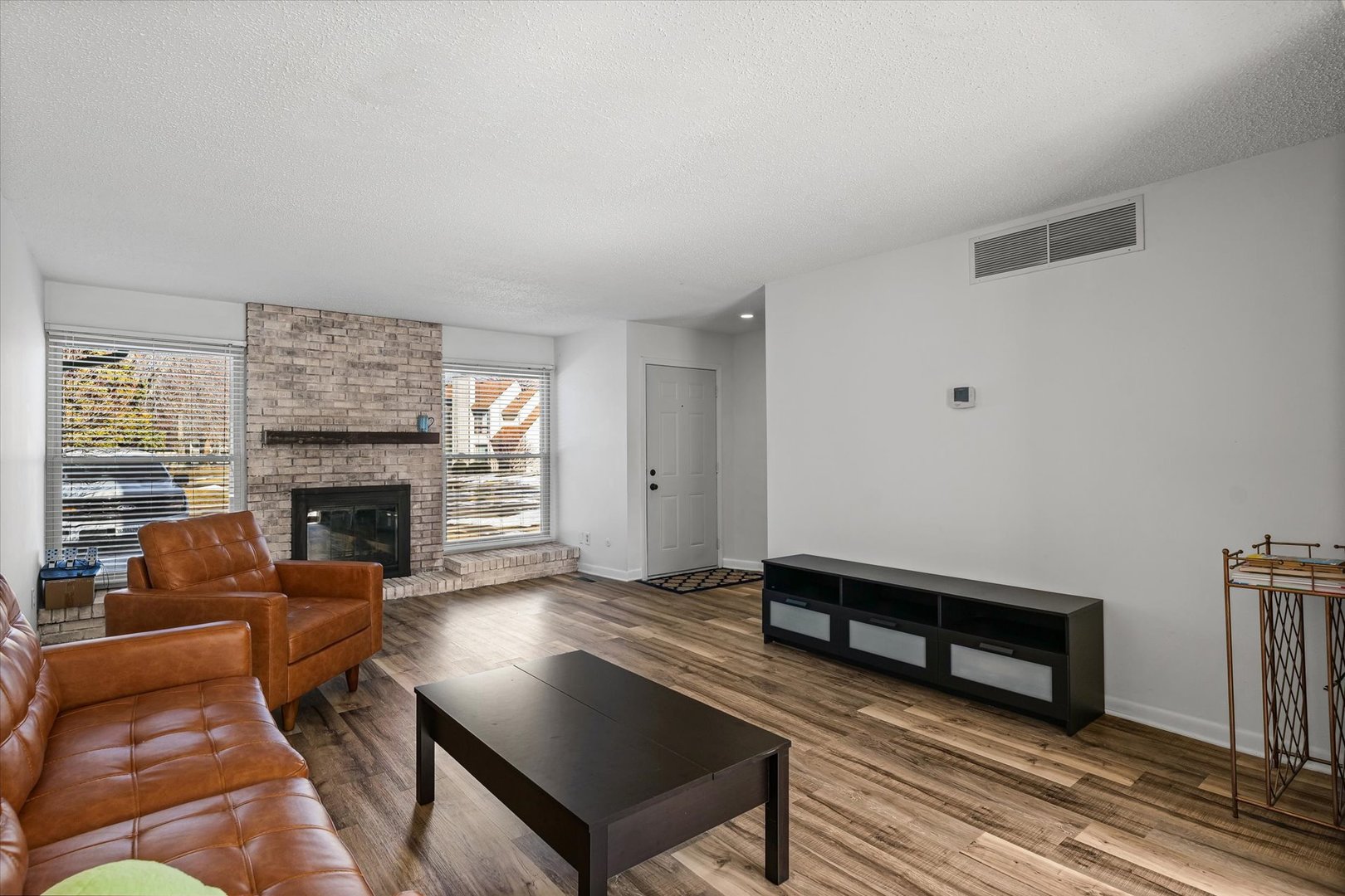 20 Colony W Drive Champaign, IL 61820 - Photo 8 of 26 a living room with furniture fireplace and wooden floor