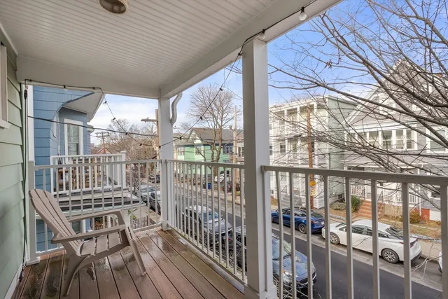 a view of a balcony with wooden floor